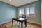 Simple office room in light blue color