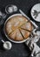 Simple orange cake with olive oil on a dark stone background.