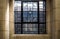 Simple patterned antique stained glass window frame in ancient building