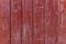 Simple photo background pattern of red wooden planks.