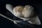 A simple photography of rustic bread on black background