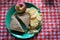 Simple picnic lunch on a red and white tablecloth