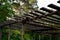 simple plank pergola for growing plants that require diffused shady light.