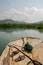 Simple plastic raft traversing mangrove forests in wetlands near Tokeh Beach, Sierra Leone, Africa