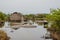 Simple reed mat homes of poor fishermen in wetlands of Benin