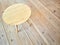 Simple round table on wooden floor