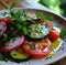 a simple salad, with olive oil, tomatoes and cucumbers