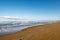 Simple sea view from Chirihama Beach Driveway on Noto Peninsula, Japan, with car tyre tracks on sand