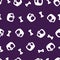Simple seamless pattern with white silhouettes of cartoon human skulls or Jolly Rogers and bones against plain purple