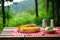 simple setup of roasted corn on picnic table