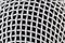 Simple silver microphone grill background texture, macro, extreme closeup. Mic metal grate mesh musical backdrop Karaoke, singing