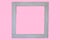 Simple square grey frame on pink with copyspace