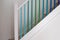 Simple staircase with blue, turquoise and green ombre painted stair spindles.