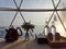 Simple table setting in glamping tent against beautiful sunrise in background.