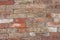 Simple texture of an old multi-colored brick