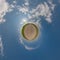 simple tiny planet without buildings in blue sky with beautiful clouds. Transformation of spherical panorama 360 degrees.