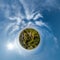 simple tiny planet without buildings in blue sky with beautiful clouds. Transformation of spherical panorama 360 degrees.