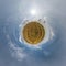 simple tiny planet without buildings in blue sky with beautiful clouds. Transformation of spherical panorama 360 degrees.