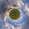 simple tiny planet without buildings in blue sky with beautiful clouds. Transformation of spherical panorama 360 degrees.