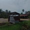 A simple toilet near the rice fields and a small river