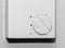 Simple wall mounted white thermostat dial for adjusting room temperature