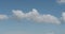 Simple white clouds over blue sky in midday