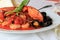 Simple white dish with Seafood Fradiavolo