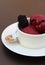 Simple white serving plate and bowl filled with fresh black raspberry sorbet