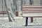 Simple wooden bench in snowy