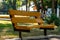 Simple wooden bench on the street in the open air in the fresh air. A place to relax, sit and think, watch what