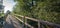 Simple wooden footbridge over a stream