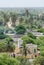Simple yellow mosque surrounded by green vegetation and palm trees at coastal town Ndiebene, Senegal