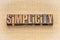 Simplicity word abstract in wood type
