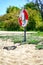 Simrishamn, Sweden - 13 May 2019: Lifebuoy on an empty sandy beach on a sunny day