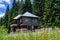 Sinaia, Romania - 3 July 2021: Old wooden building of Scropoasa Cottage Cabana Scropoasa in Bucegi Mountains Muntii Bucegi in