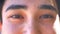 Sincere asian guy is looking at camera precisely, not blinking, close-up brown eyes, black hair