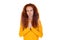 Sincere redhead woman holds hands together praying pose
