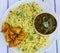 Sindhi thali- garlic rice,fried potatoes and lentils