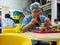 SINGAPORE - 17 MAR 2019 - A middle aged Asian Chinese Singaporean man enjoys a bowl of noodles at an eatery / coffeeshop /