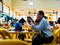 SINGAPORE - 17 MAR 2019 - A middle aged man in office atire enjoys a late night beer at an eatery / coffeeshop / kopitiam, /