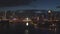 Singapore - 25 September 2018: Singapore cityscape panorama by night with farris wheel behind the river. Shot. Aerial