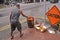 Singapore 28.08.2017. - Man with Sacrificial burning and offering on street on The Chinese Ghost Festival Spirit Festival.