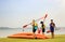 Singapore-29 JUN 2019:three people Going to Kayaking on the beach