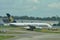 Singapore Airlines Airbus 380 super jumbo being towed across taxi-way at Changi Airport