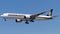 Singapore Airlines aircraft soaring against a blue sky backdrop.