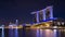 Singapore business building skyline at dawn with reflexion on waterbay in twilight time.Illuminated Marina bay sand at night