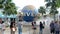 SINGAPORE - JANUARY 13 Tourists and theme park visitors taking pictures of the large rotating globe fountain in front of Universal