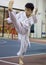 Singapore - July 28, 2016: A boy performing a high kick during a taekwondo training session