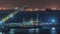 Singapore Marina Barrage with cargo ships waiting to enter one of the busiest ports in the world night timelapse