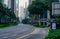 SINGAPORE-MAY 20, 2019 : Quiet asphalt road with green tree and garden beside the road with skyscraper building. Financial center